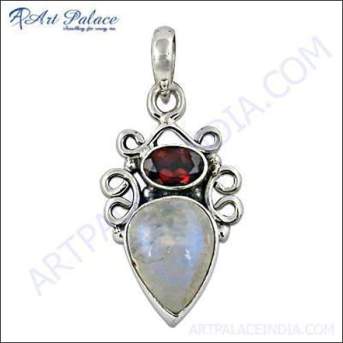 A stunning silver pendant featuring garnet and rainbow moonstone, showcasing intricate craftsmanship and vibrant colors.