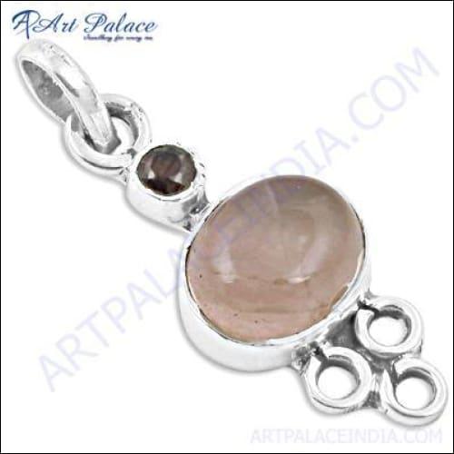 Stunning silver pendant featuring garnet and rose quartz, showcasing elegant design and craftsmanship.