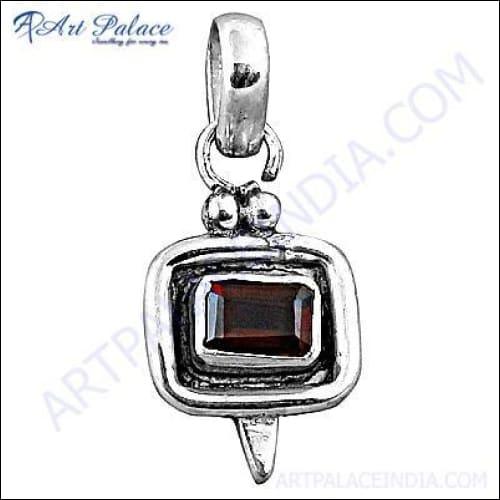 Stunning garnet pendant featuring a genuine garnet gemstone set in elegant sterling silver, showcasing intricate design and craftsmanship.