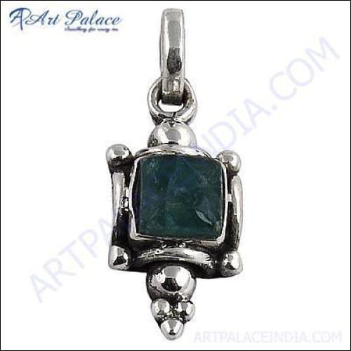 A stunning silver pendant featuring a vibrant gemstone, showcasing intricate craftsmanship and elegant design.