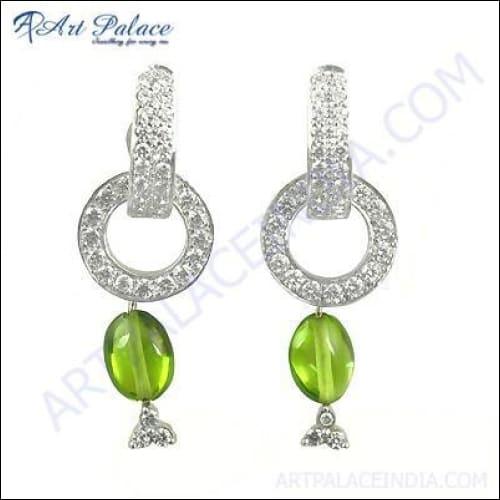 Stunning silver earrings featuring genuine cubic zirconia and peridot gemstones, showcasing elegant design and craftsmanship.