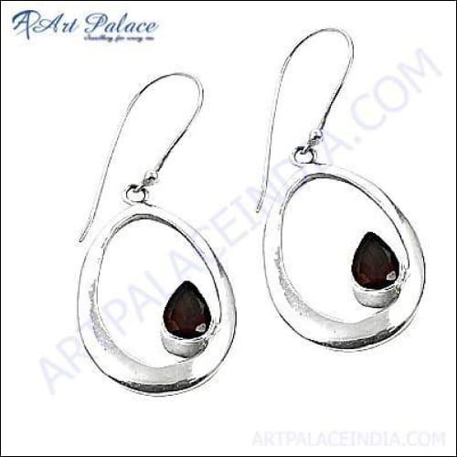 A pair of stunning genuine garnet gemstone silver earrings, showcasing deep red garnets set in elegant silver design.
