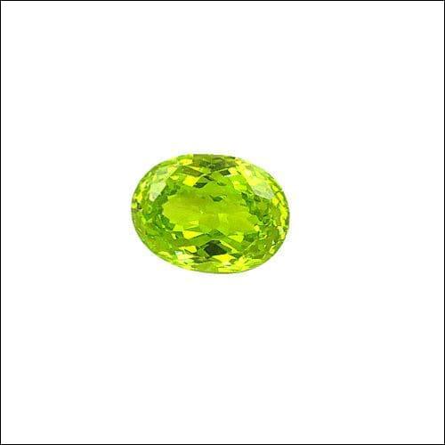 A stunning Green Peridot Cubic Zirconia Loose Gemstone showcasing a vibrant green hue and brilliant sparkle, perfect for jewelry making.
