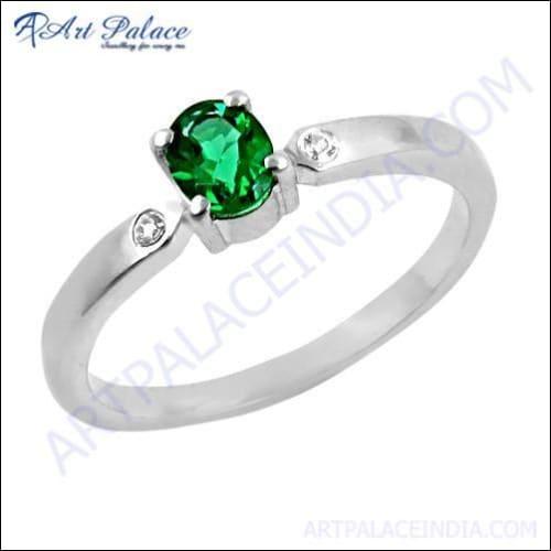 A stunning silver ring featuring green and white cubic zirconia stones, showcasing intricate craftsmanship and elegant design.