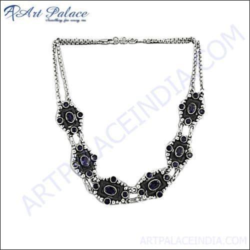 A stunning handmade Indian designer necklace featuring deep blue iolite gemstones set in genuine sterling silver, showcasing intricate craftsmanship.