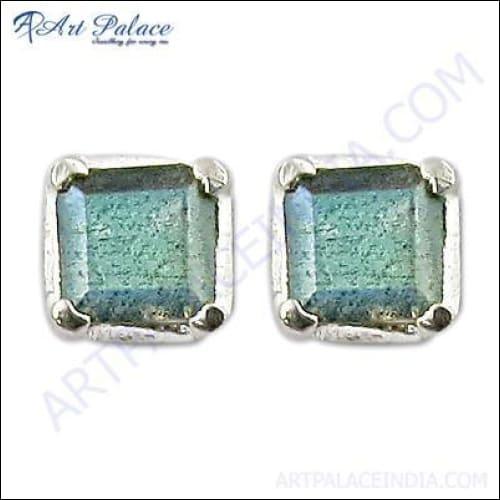 A pair of handcrafted Indian silver earrings featuring stunning Labradorite stones, showcasing intricate design and craftsmanship.