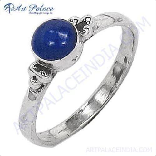 A stunning silver ring featuring a deep blue lapis lazuli gemstone, showcasing intricate craftsmanship and elegant design.