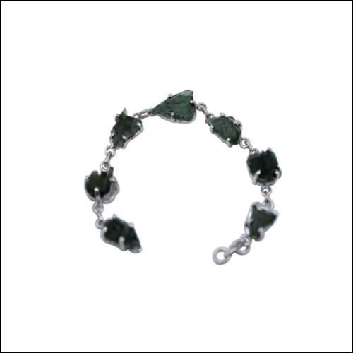 A stunning moldavite stone bracelet set in 925 silver, showcasing its unique green hue and elegant design.
