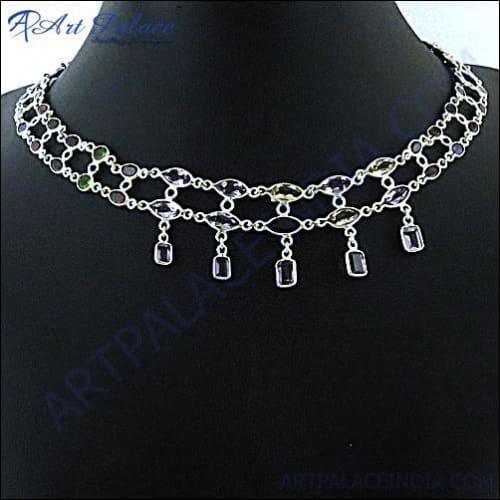 A stunning silver necklace featuring vibrant amethyst, citrine, and garnet gemstones, showcasing exquisite craftsmanship and elegant design.