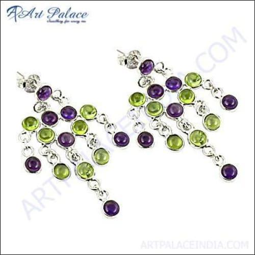 A pair of stunning handcrafted multi-stone silver earrings featuring intricate designs and vibrant stones, showcasing Indian craftsmanship.