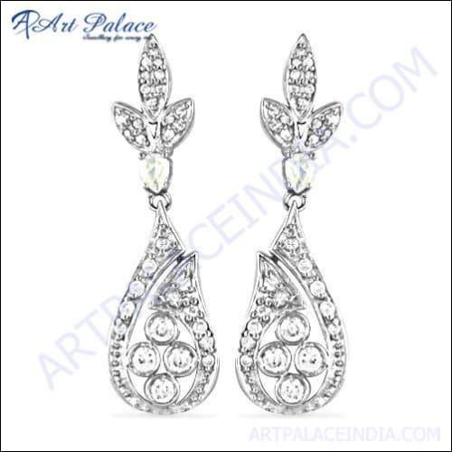 Stunning silver earrings featuring cubic zirconia gemstones, perfect for party wear, showcasing intricate design and elegance.