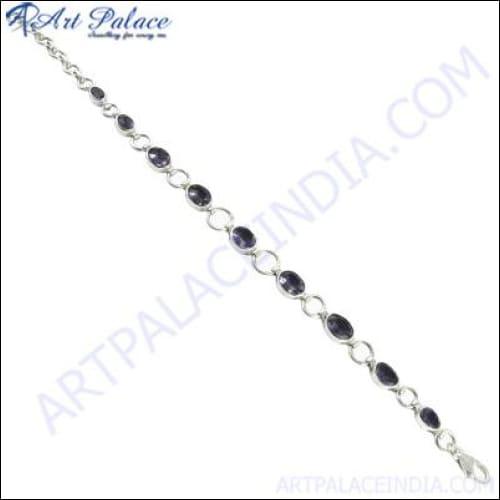 A stunning silver gemstone bracelet designed for parties, featuring intricate craftsmanship and sparkling gemstones.