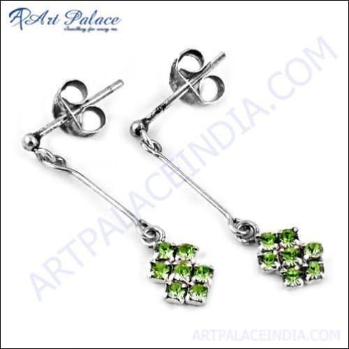 Stunning silver earrings featuring vibrant Peridot and sparkling Zircon gemstones, elegantly designed for a unique jewelry collection.