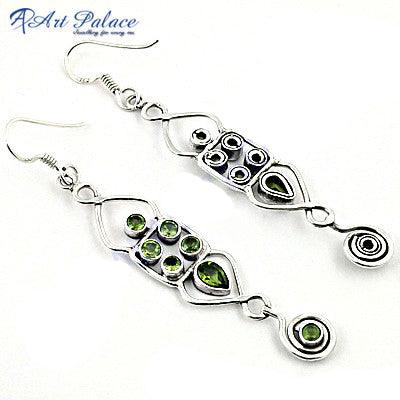 Stunning peridot gemstone earrings set in 925 silver, showcasing vibrant green stones and elegant design.