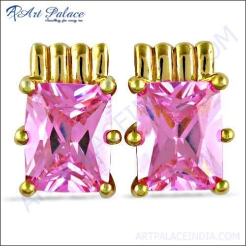 A pair of elegant silver earrings featuring stunning pink cubic zirconia gemstones, showcasing their sparkle and intricate design.