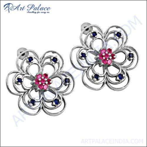 Stunning pink CZ gemstone silver earrings featuring an intricate flower design, showcasing elegance and craftsmanship.