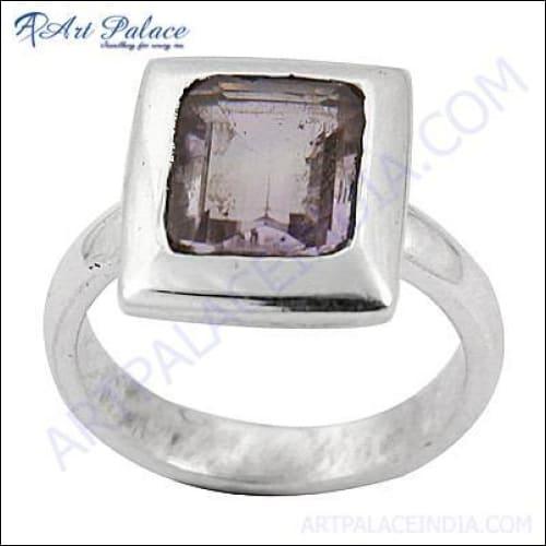 A stunning silver ring featuring a princess cut amethyst gemstone, showcasing elegance and craftsmanship.