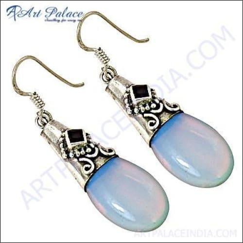 Stunning silver earrings featuring garnet and opal gemstones, showcasing intricate craftsmanship and elegant design.