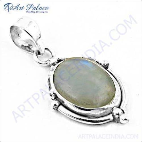 A stunning oval rainbow moonstone pendant set in sterling silver, showcasing its captivating play of colors, perfect for party wear.