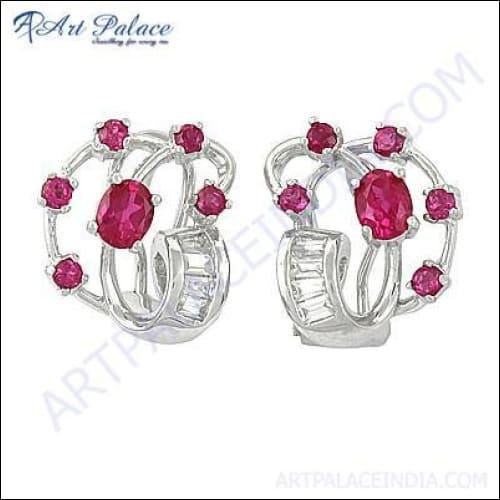 A pair of stunning red cubic zirconia gemstone silver earrings, showcasing a vibrant red stone set in a polished silver frame, perfect for elegant occasions.