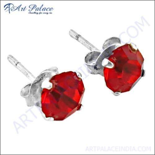 Stunning red cubic zirconia gemstone silver stud earrings showcasing elegant design and craftsmanship.
