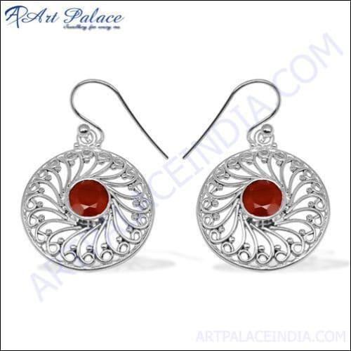 A pair of stunning red onyx and silver earrings, showcasing intricate design and vibrant color, perfect for elegant occasions.