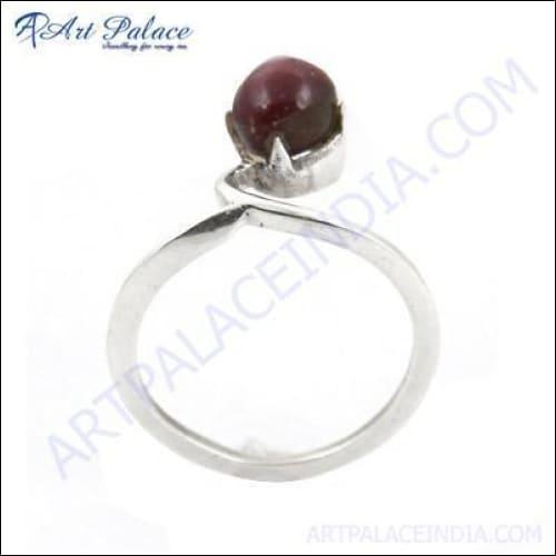 A stunning silver ring featuring a vibrant ruby gemstone, showcasing elegant craftsmanship and design.