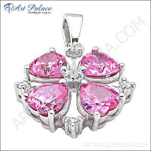 A stunning silver pendant featuring a semi-precious pink cubic zirconia gemstone, showcasing intricate craftsmanship and elegant design.
