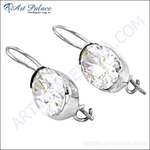 A pair of stunning silver earrings featuring sparkling cubic zirconia gemstones, showcasing intricate design and craftsmanship.