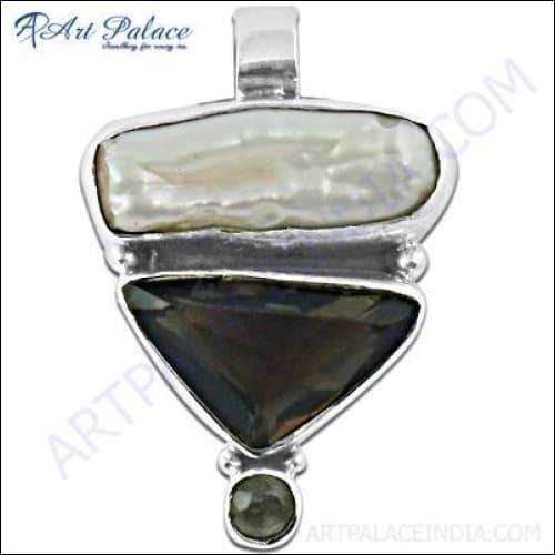 A stunning silver pendant featuring a precious pearl and smokey quartz, showcasing intricate craftsmanship and elegant design.