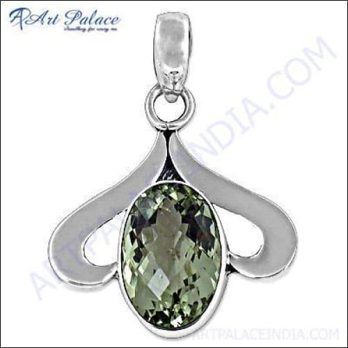 Elegant silver pendant featuring a sparkling green amethyst gemstone, showcasing intricate craftsmanship and design.