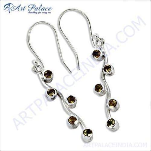 Stunning silver earrings featuring vibrant citrine gemstones, elegantly designed for a sophisticated look.