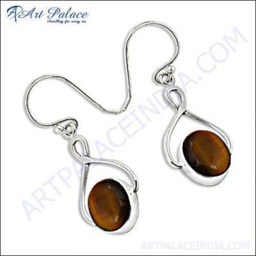 A pair of stunning handmade silver earrings featuring tiger eye gemstones, showcasing their unique golden-brown hues and elegant design.
