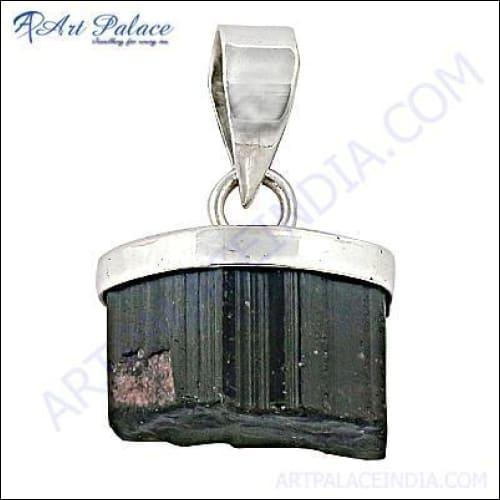 A stunning silver pendant featuring a vibrant tourmaline gemstone, showcasing intricate craftsmanship and elegant design.