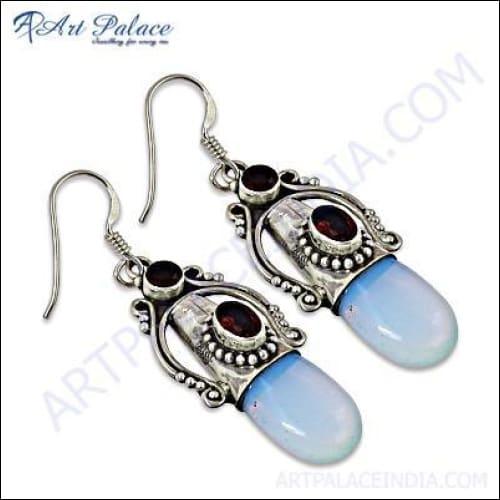Stunning traditional silver earrings featuring synthetic opal and garnet gemstones, showcasing intricate craftsmanship and vibrant colors.