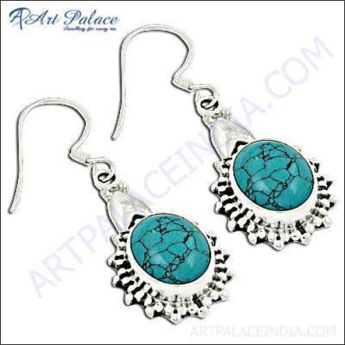 A pair of stunning traditional synthetic turquoise gemstone earrings, showcasing intricate design and vibrant colors, perfect for any occasion.