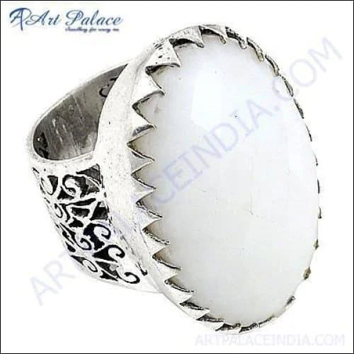 A stunning silver fretwork ring featuring a beautiful white onyx gemstone, showcasing intricate detailing and elegant design.