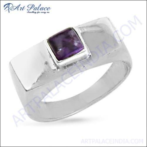 Stylish silver ring featuring a vibrant amethyst gemstone, showcasing intricate craftsmanship and elegant design.
