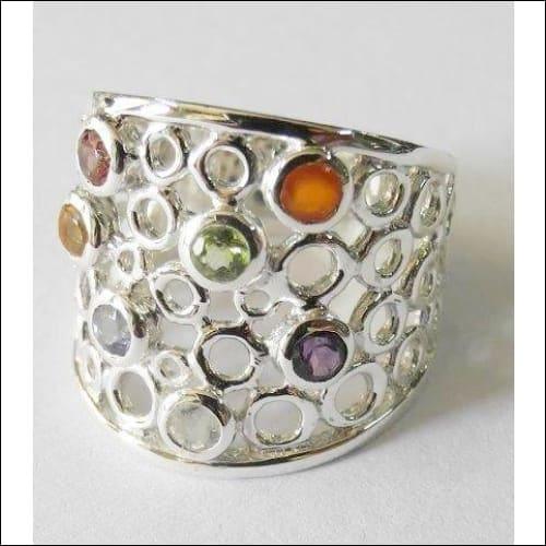 Stylish Chakra Pierced Round Facet Silver Ring featuring natural gemstones, showcasing intricate craftsmanship and elegant design.