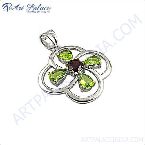 Stylish silver pendant featuring garnet and peridot gemstones, showcasing intricate design and craftsmanship.