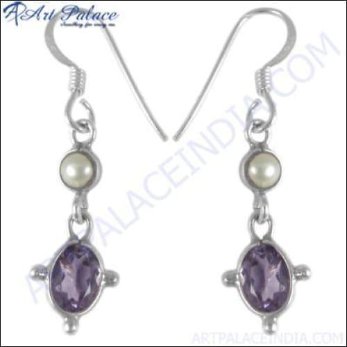 A pair of elegant silver earrings featuring colorful gemstones, showcasing intricate craftsmanship and stylish design.