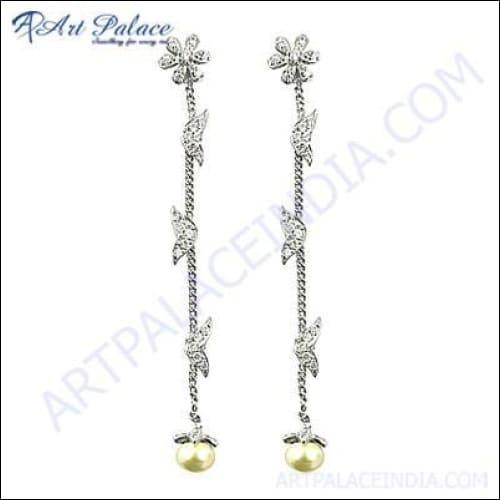 Stylish silver earrings featuring pearls and cubic zirconia, showcasing elegant design and craftsmanship.