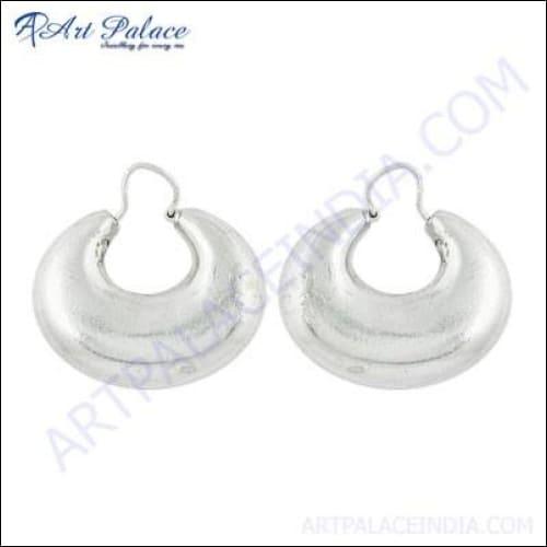 A pair of stylish plain silver earrings showcasing a minimalist design, perfect for any occasion in 2023.