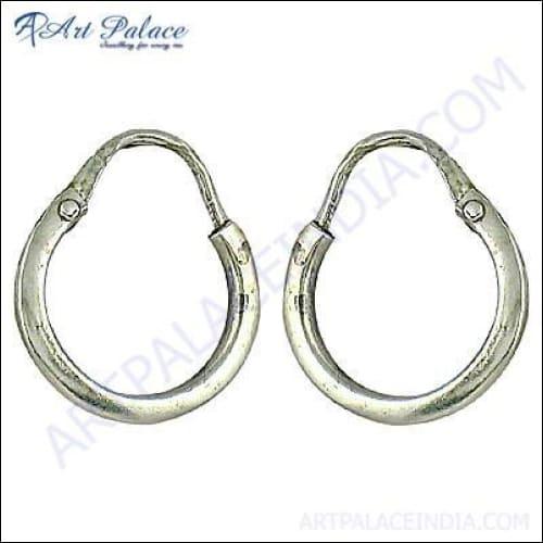 A pair of stylish plain silver hoop earrings, showcasing a sleek and elegant design, perfect for any occasion.
