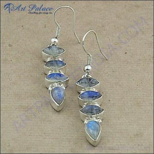 Stylish dangle earrings featuring rainbow moonstone set in white metal, showcasing a unique design and vibrant colors.