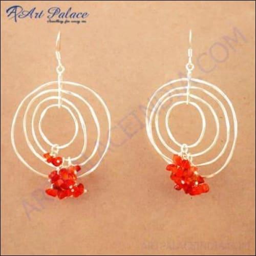 Stylish red carnelian gemstone silver earrings with spiral beaded design, showcasing elegance and craftsmanship.