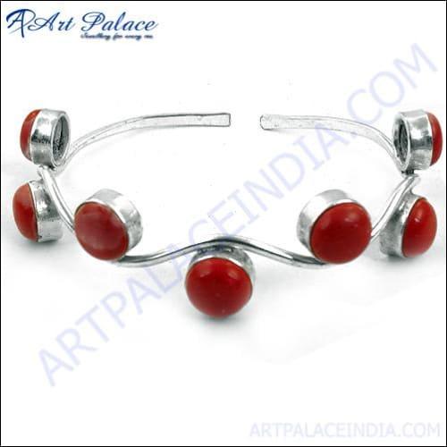 Stylish Synthetic Coral Gemstone Silver Bangle showcasing a vibrant coral stone set in a sleek silver design, perfect for any occasion.