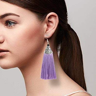 A pair of elegant purple tassel threader earrings with a metal cap, showcasing a boho style.