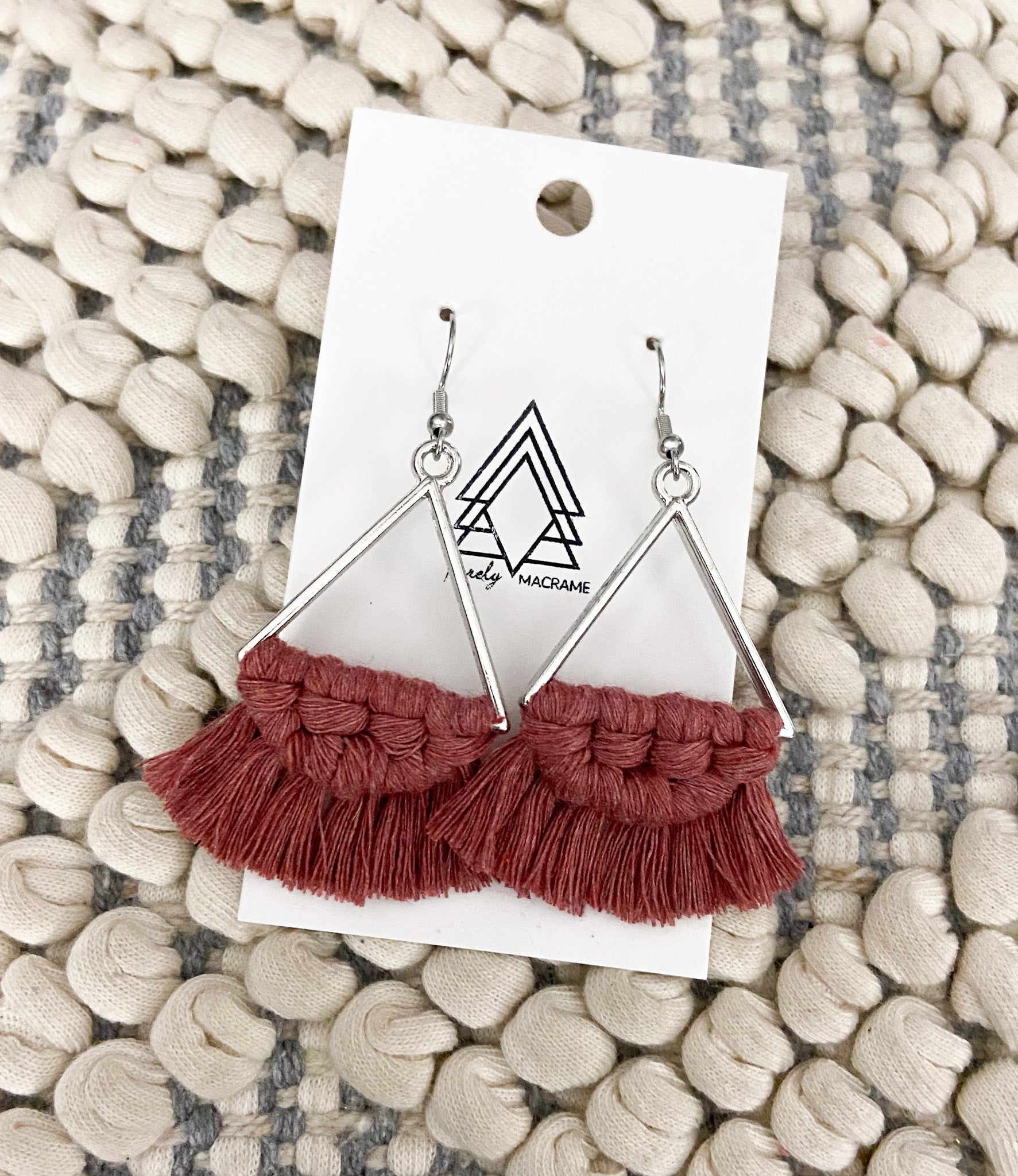 Elegant Terracotta Silver Triangles earrings made from natural cotton with stainless steel hooks, showcasing a unique design.