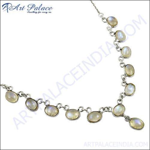 A stunning silver necklace featuring a unique rainbow moonstone gemstone, showcasing its iridescent colors and elegant design.